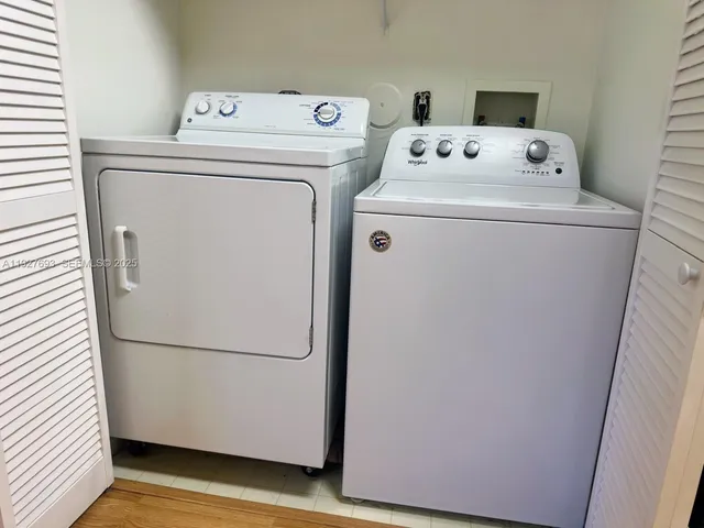 a utility room with dryer and washer