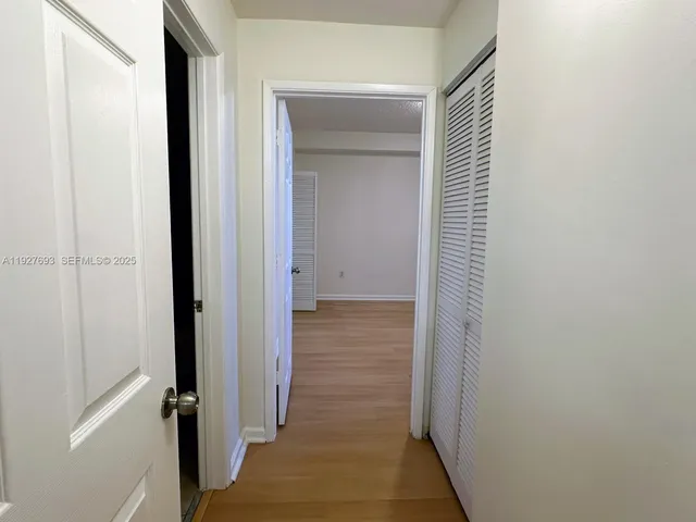 a view of a bathroom from a hallway
