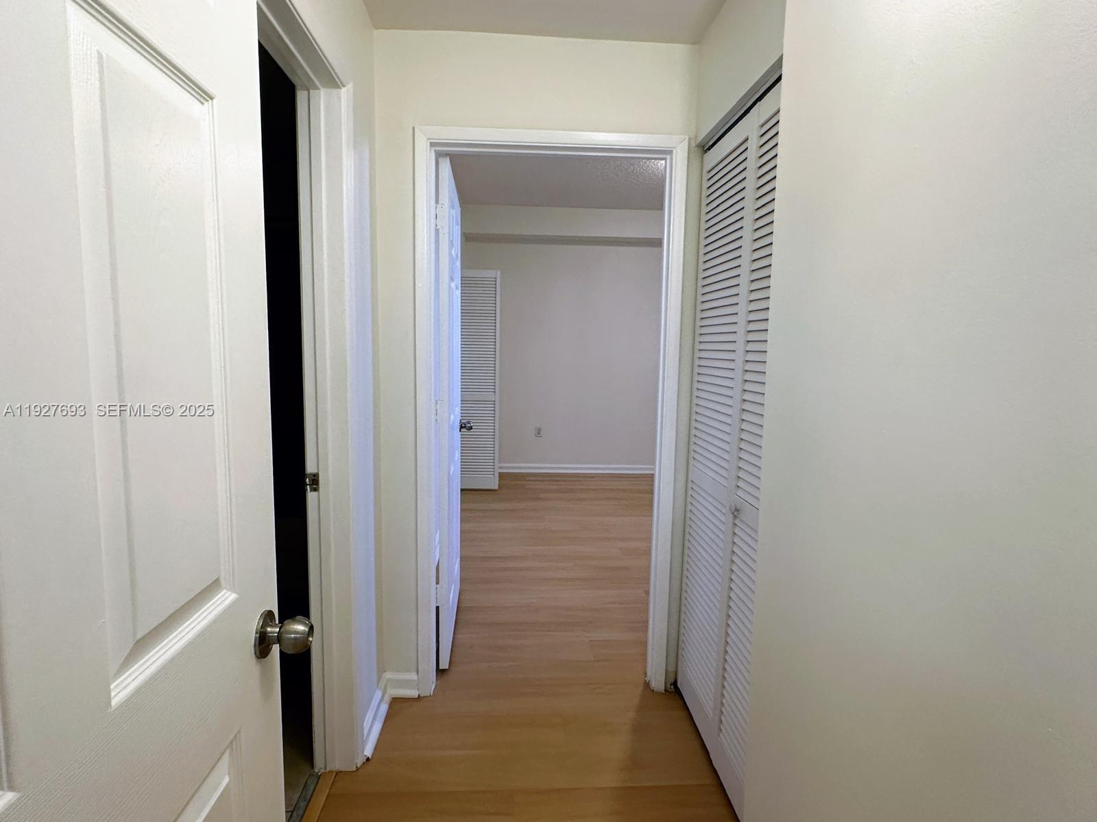 1919 Van Buren Street, Unit 118A Hollywood, FL 33020 - Photo 14 of 36 a view of a bathroom from a hallway