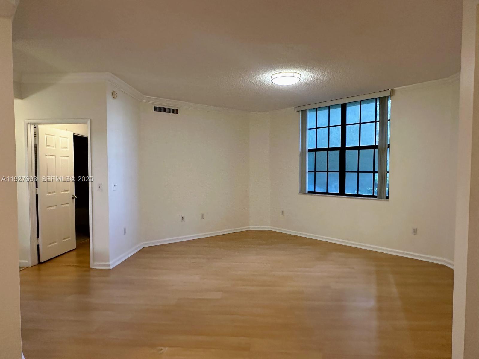 1919 Van Buren Street, Unit 118A Hollywood, FL 33020 - Photo 15 of 36 a view of an empty room with a window