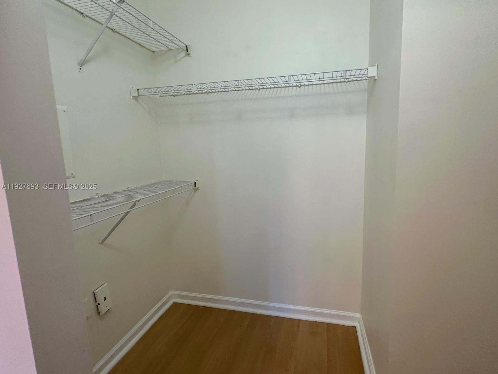 1919 Van Buren Street, Unit 118A Hollywood, FL 33020 - Photo 17 of 36 a view of a room with racks on the wall