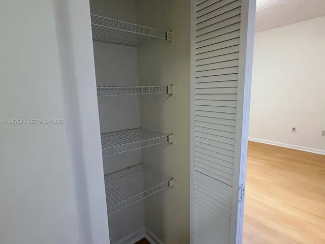 a view of an empty walk in closet