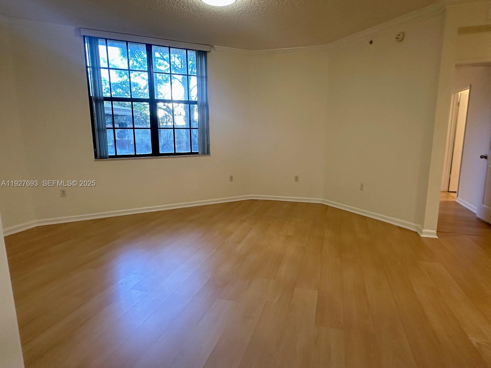 1919 Van Buren Street, Unit 118A Hollywood, FL 33020 - Photo 24 of 36 an empty room with a window