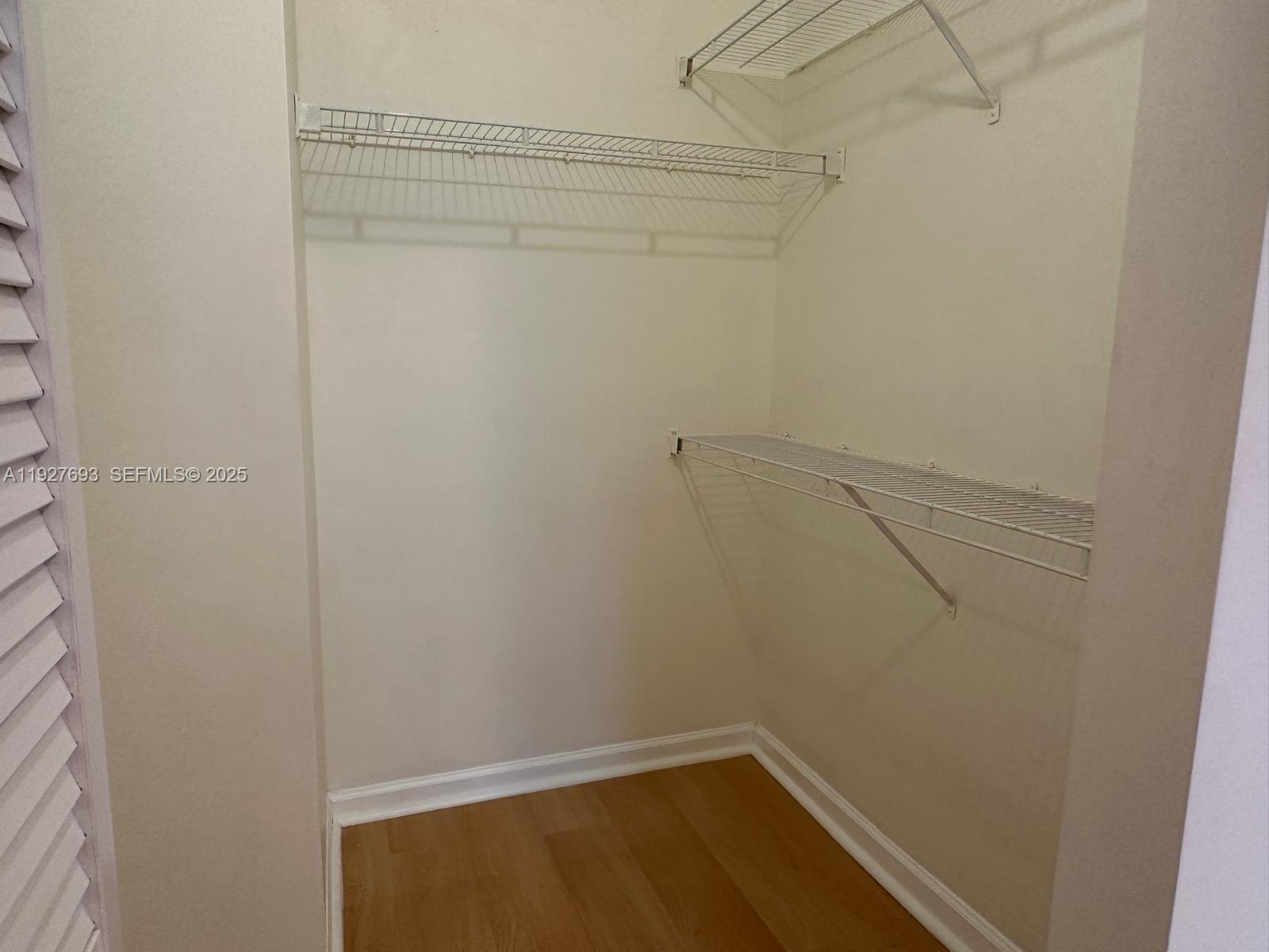 1919 Van Buren Street, Unit 118A Hollywood, FL 33020 - Photo 25 of 36 a view of a room with racks on the wall