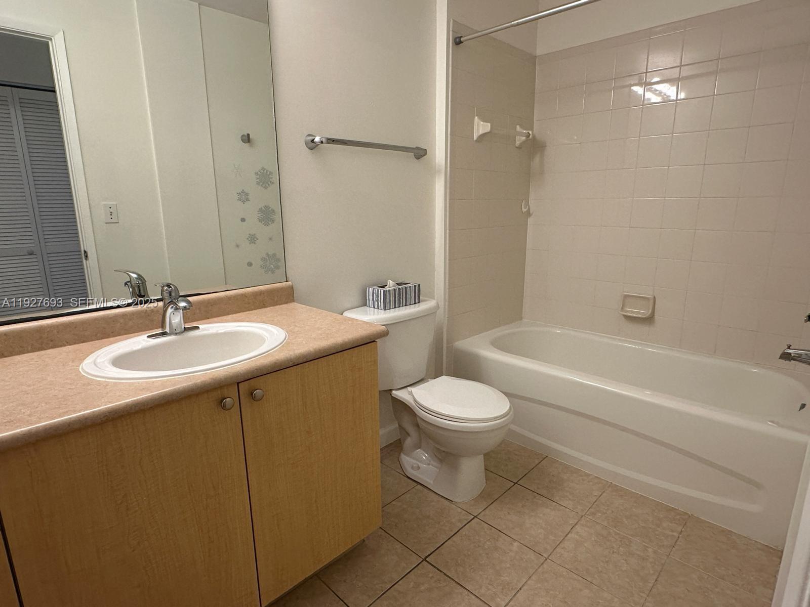 1919 Van Buren Street, Unit 118A Hollywood, FL 33020 - Photo 26 of 36 a bathroom with a sink a toilet and shower