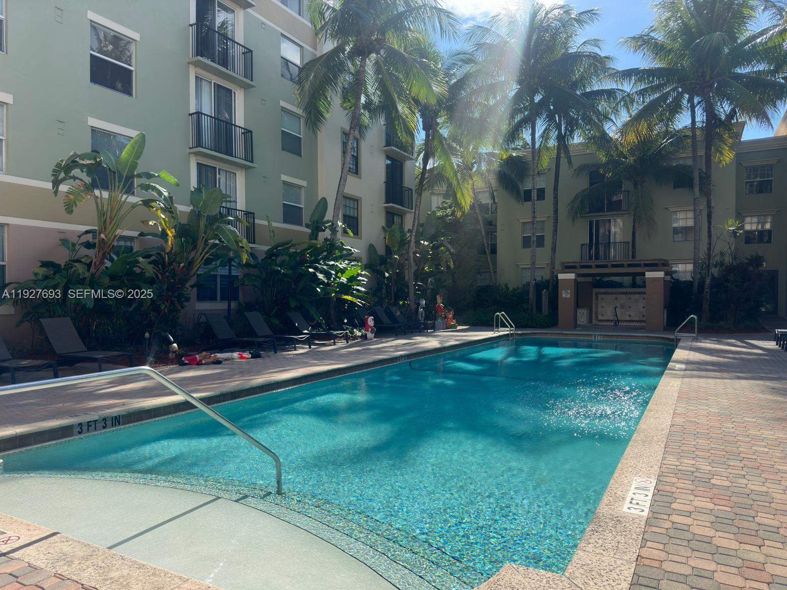 1919 Van Buren Street, Unit 118A Hollywood, FL 33020 - Photo 30 of 36 a view of a backyard with a patio