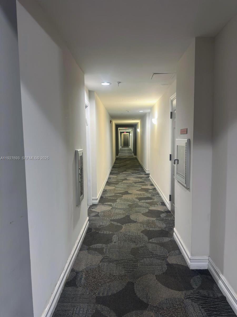 1919 Van Buren Street, Unit 118A Hollywood, FL 33020 - Photo 3 of 36 wooden floor with a gallery