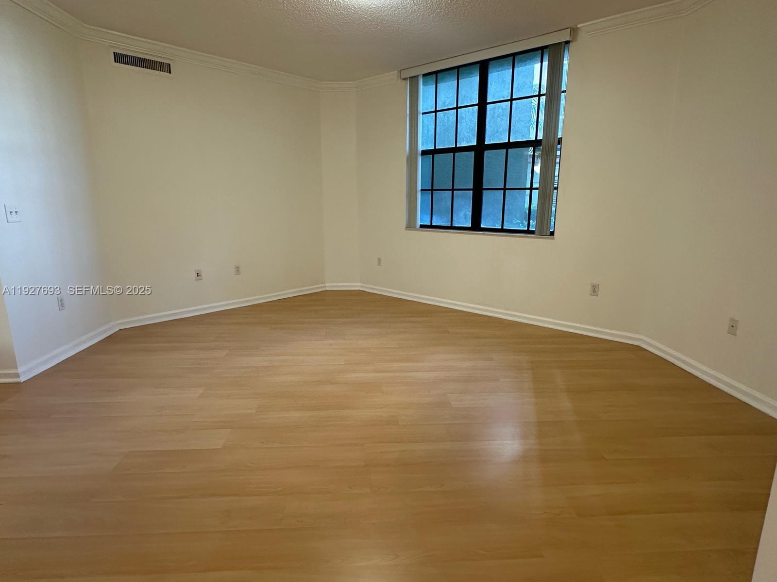 1919 Van Buren Street, Unit 118A Hollywood, FL 33020 - Photo 5 of 36 an empty room with a window