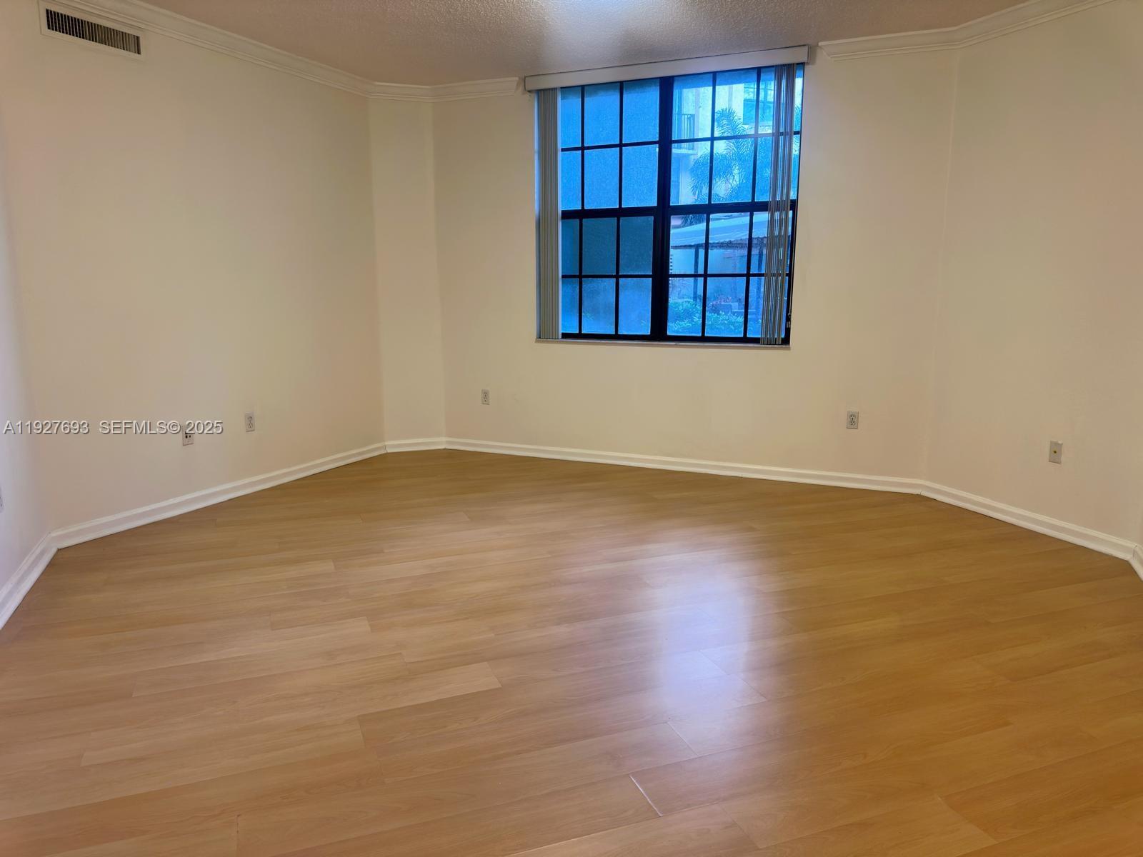 1919 Van Buren Street, Unit 118A Hollywood, FL 33020 - Photo 6 of 36 an empty room with a empty space and windows