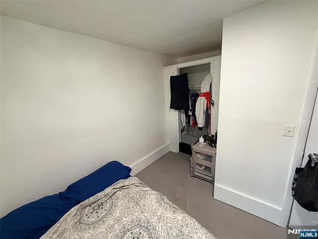 a view of a room with workspace and a window