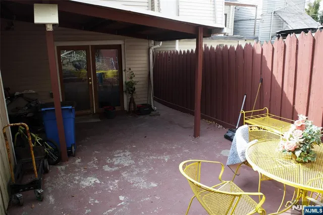 a view of a backyard with furniture and outdoor space