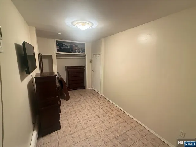 a view of a livingroom with furniture and a flat screen tv