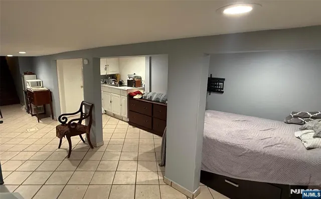 a bedroom with a bed and furniture