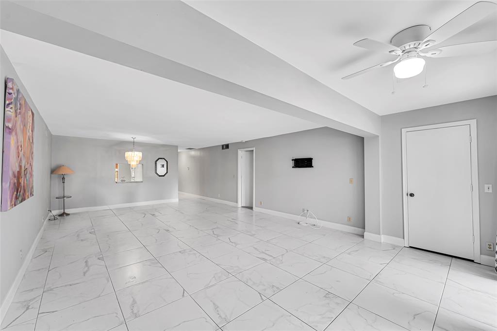 1521 Northwest 19th Terrace, Unit 101 Delray Beach, FL 33445 - Photo 19 of 42 a view of an empty room with a window