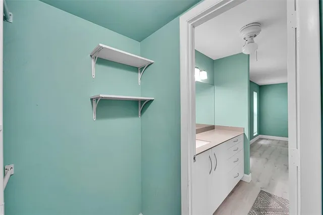 a bathroom with a sink and mirror