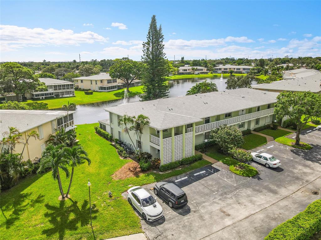 1521 Northwest 19th Terrace, Unit 101 Delray Beach, FL 33445 - Photo 35 of 42 an aerial view of a house with a garden and lake view