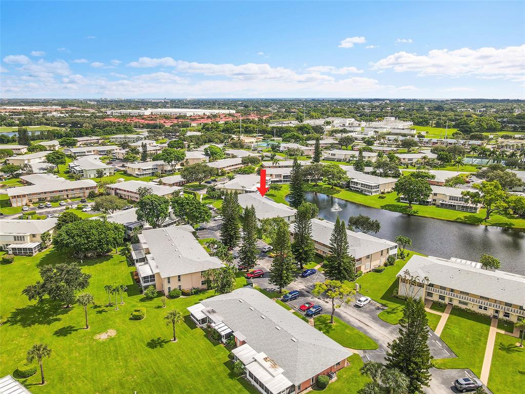 1521 Northwest 19th Terrace, Unit 101 Delray Beach, FL 33445 - Photo 40 of 42 an aerial view of residential houses with outdoor space