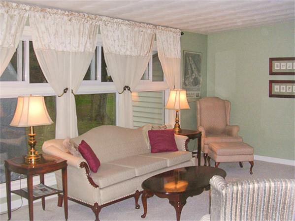 6 Donna Road Chelmsford, MA 01824 - Photo 2 of 9 a living room with furniture and a lamp