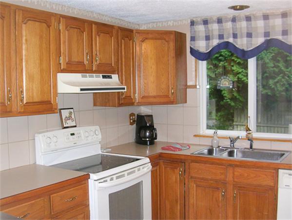 6 Donna Road Chelmsford, MA 01824 - Photo 3 of 9 a kitchen with a sink a window and cabinets