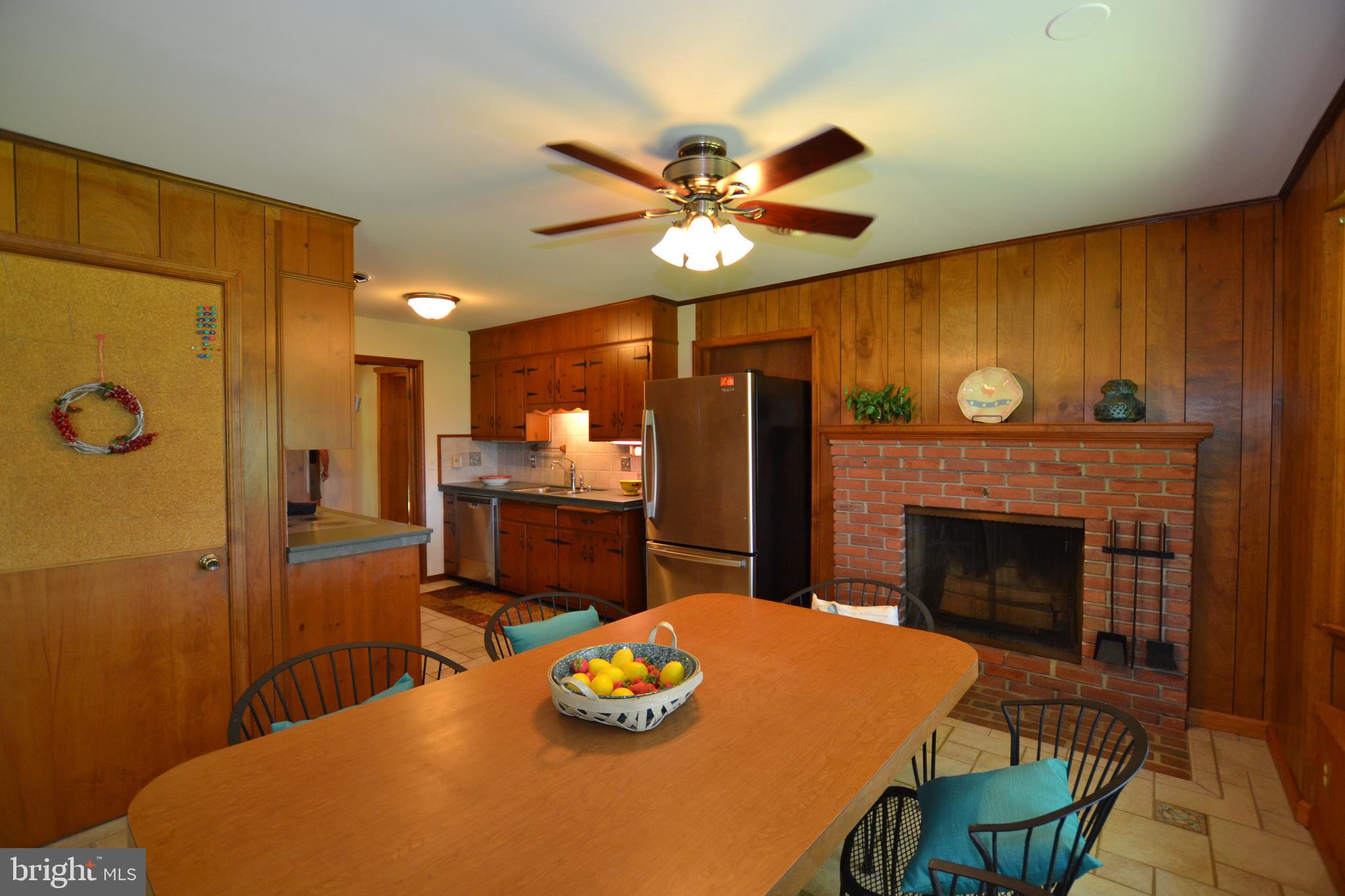 24403 Hipsley Mill Road Gaithersburg, MD 20882 - Photo 21 of 43 Table Spaced Kitchen with Fireplace