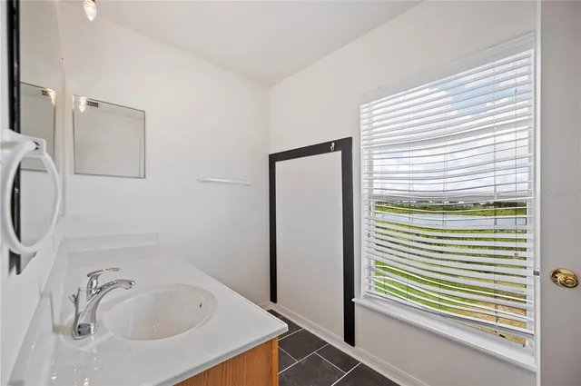a bathroom with a tub and a sink