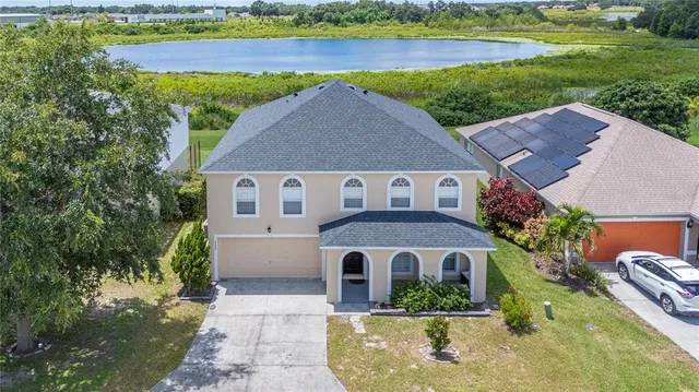 a aerial view of a house with a yard