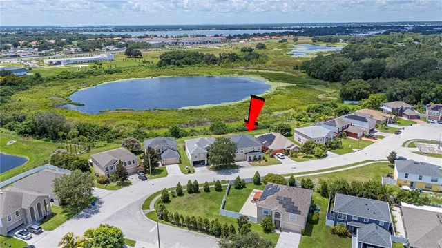 an aerial view of residential houses and outdoor space