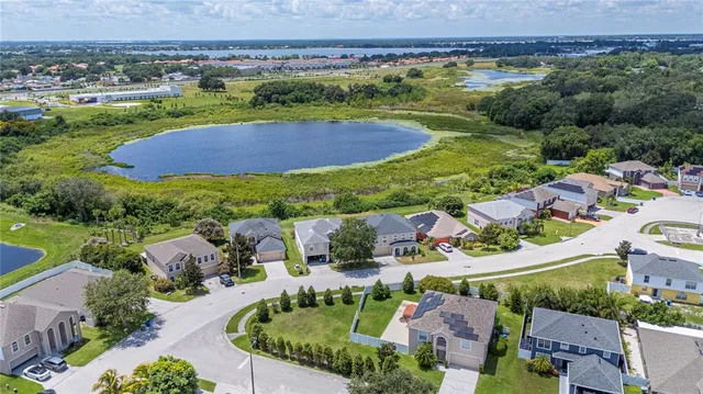 an aerial view of residential houses and outdoor space