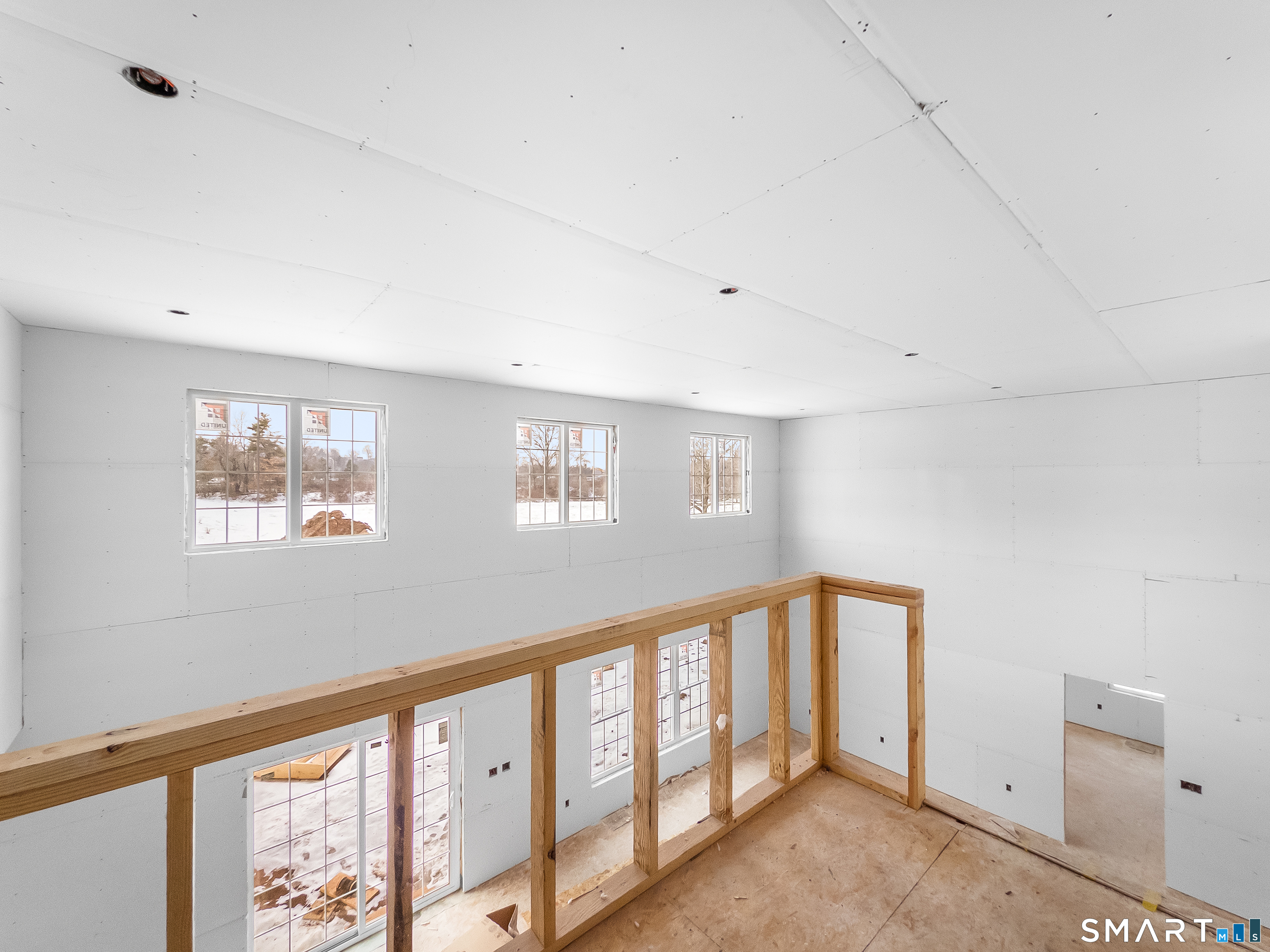180 Bee Street Meriden, CT 06450 - Photo 2 of 25 a view of an empty room with windows