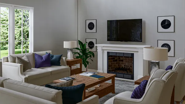 a living room with furniture flat screen tv and a fireplace