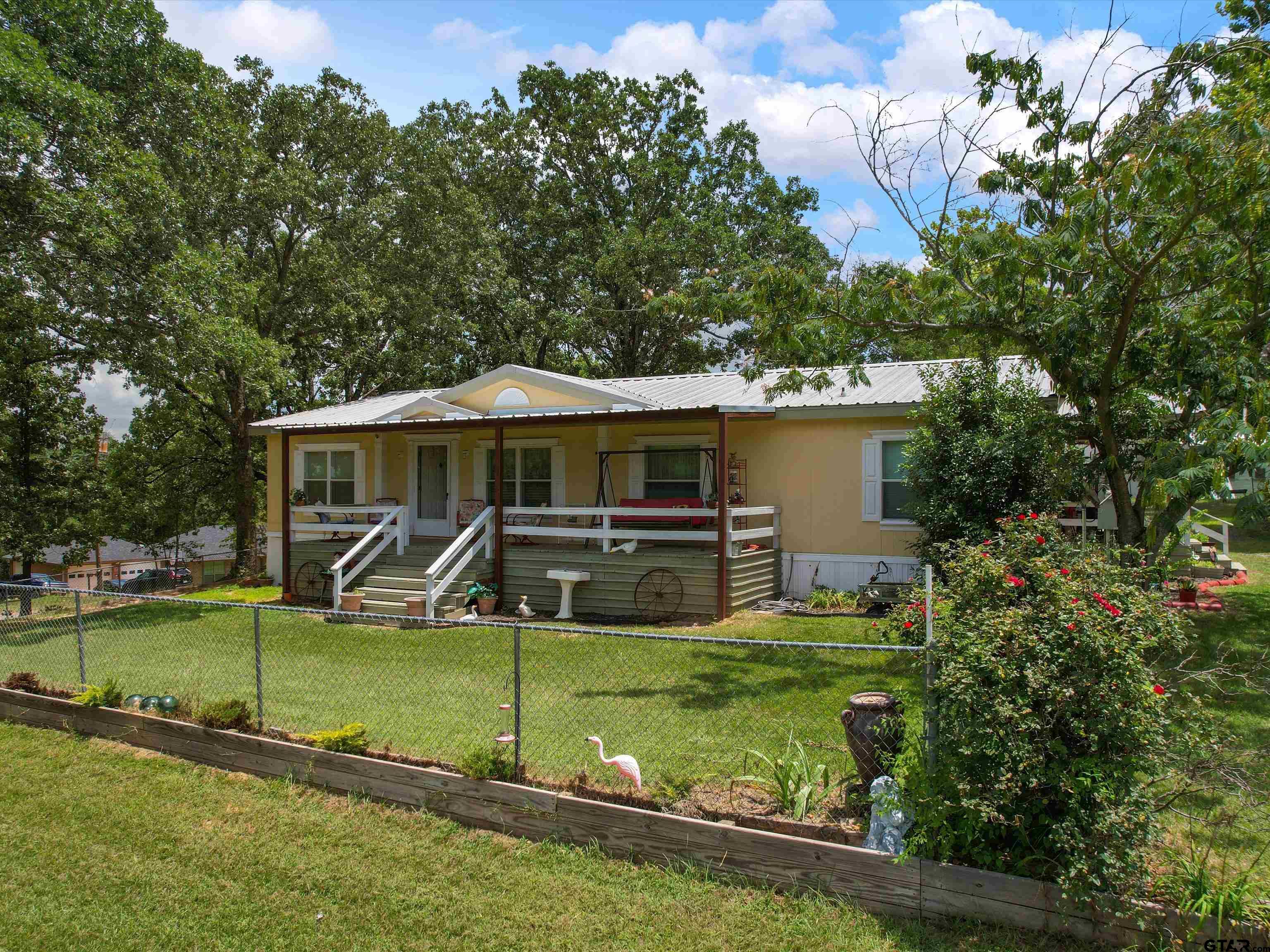 2811 Medlin Road Gilmer, TX 75645 - Photo 1 of 30 a view of a house with a yard