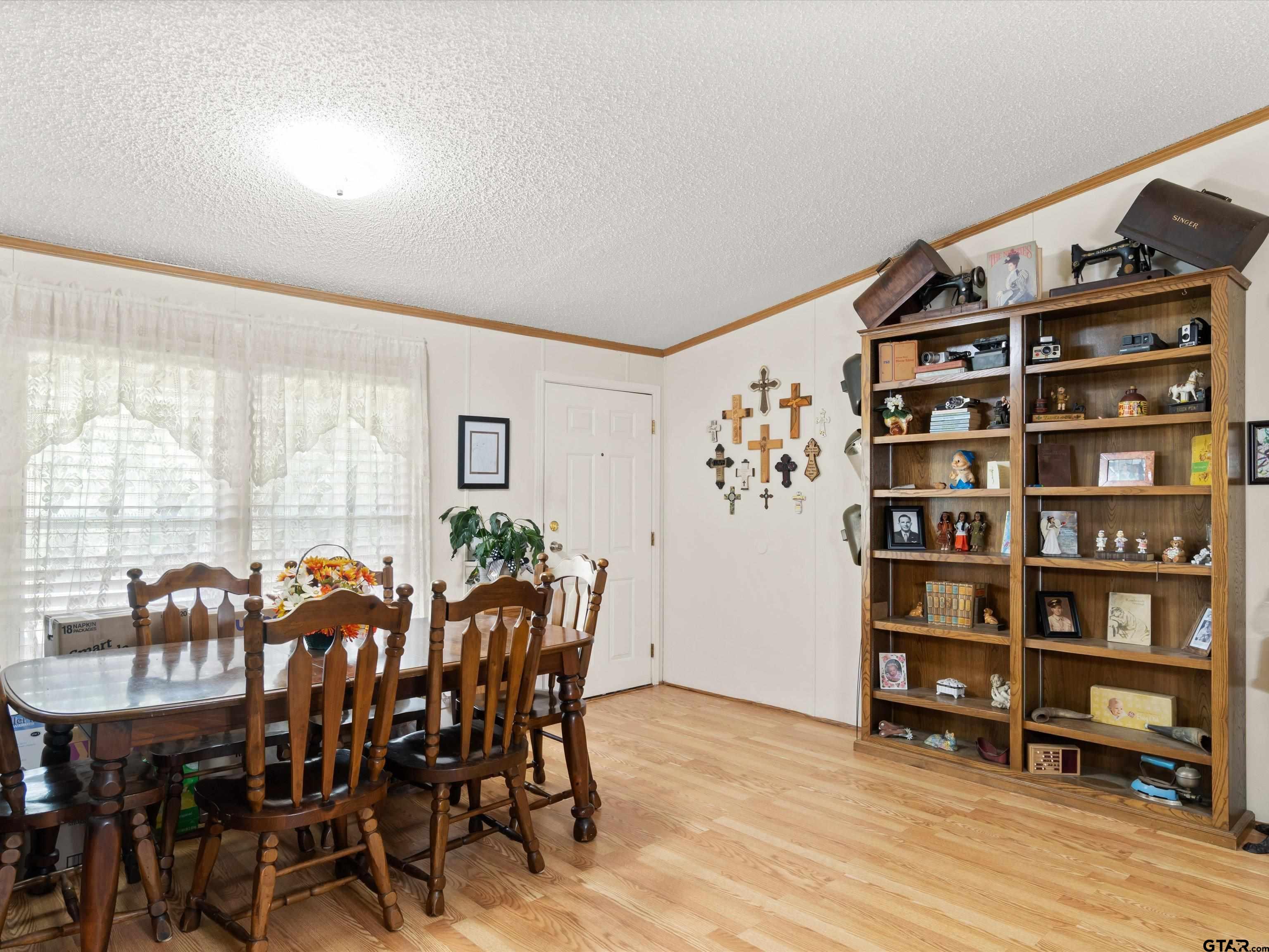 2811 Medlin Road Gilmer, TX 75645 - Photo 13 of 30 a view of a livingroom with furniture and window