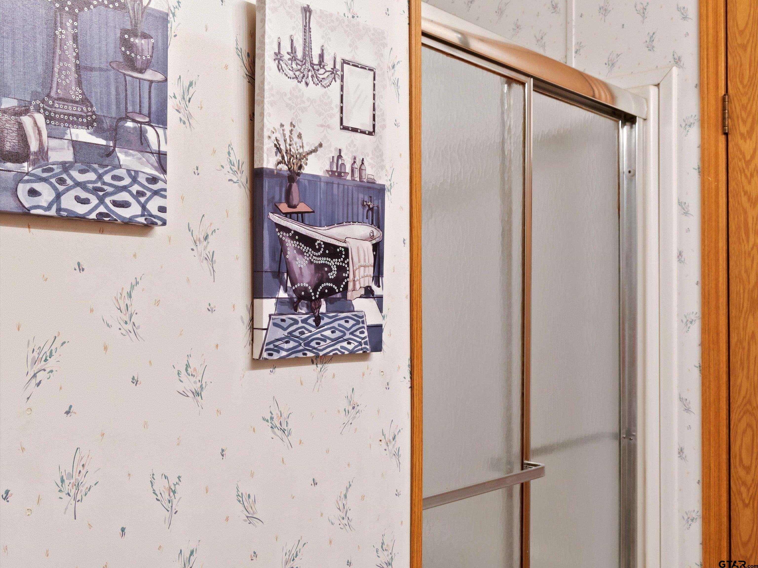 2811 Medlin Road Gilmer, TX 75645 - Photo 25 of 30 a bathroom with a shower and a glass door