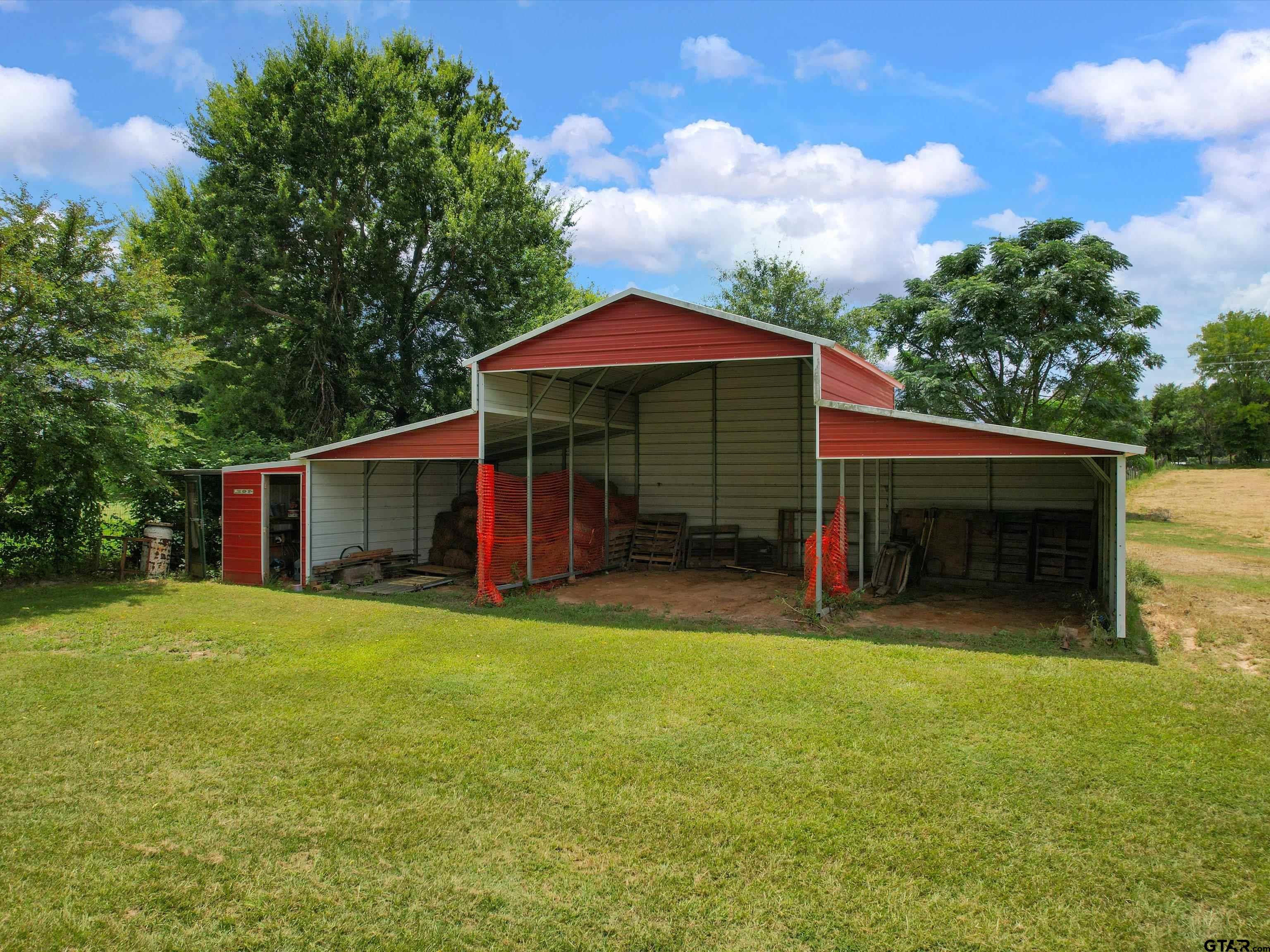 2811 Medlin Road Gilmer, TX 75645 - Photo 6 of 30 a view of a house with pool and a yard