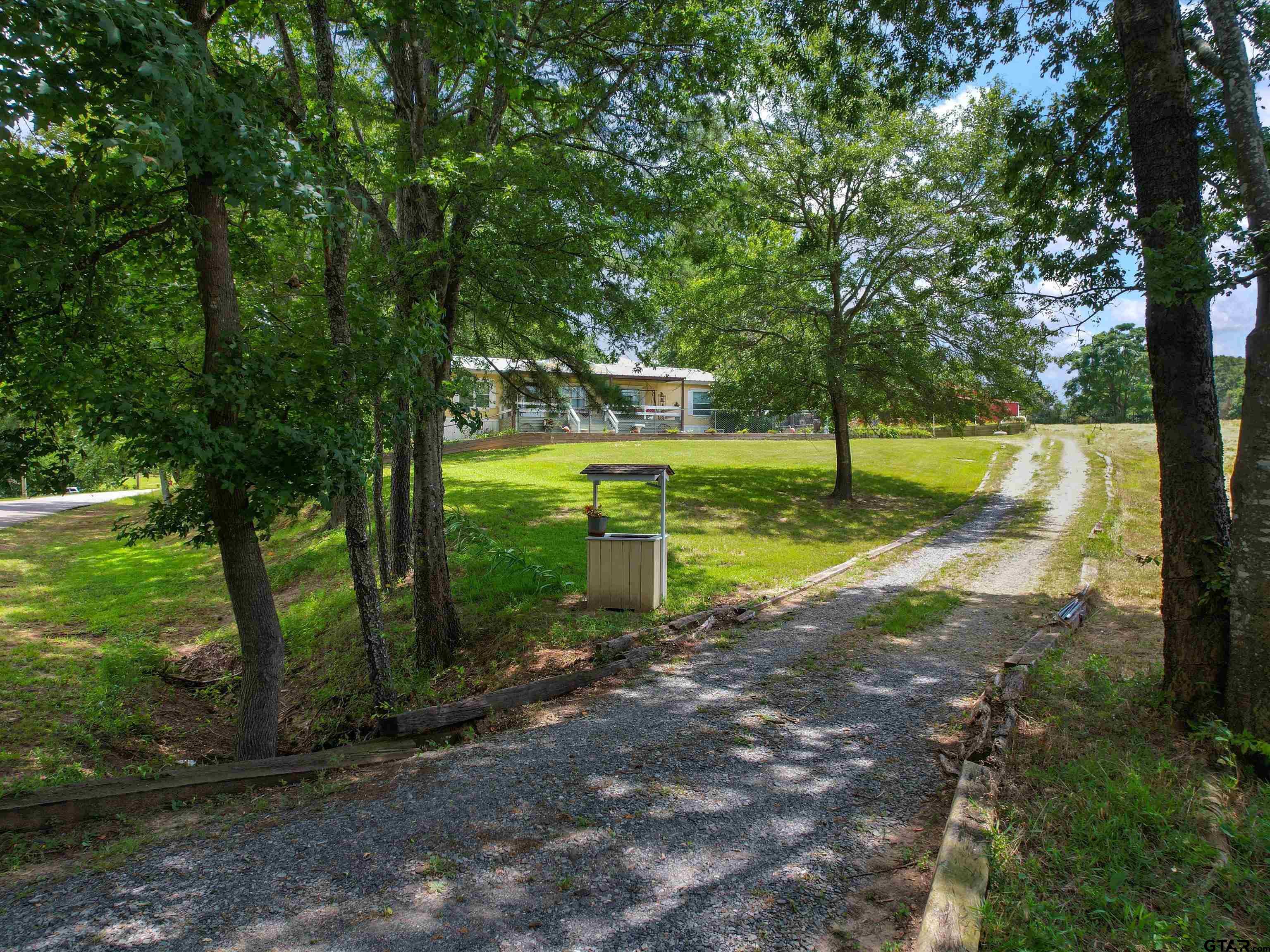 2811 Medlin Road Gilmer, TX 75645 - Photo 10 of 30 a view of a park with large trees