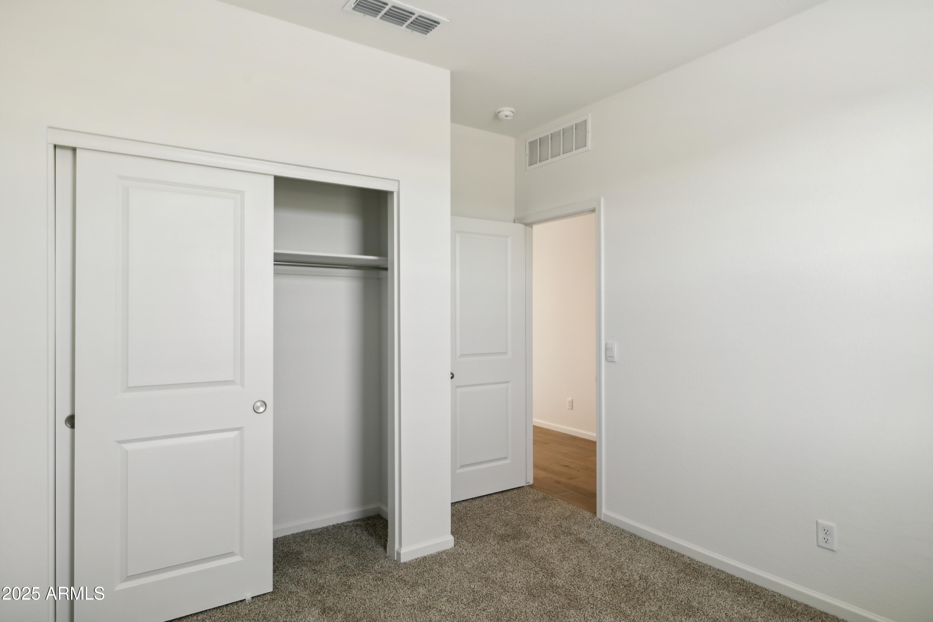25470 West Fraktur Road Buckeye, AZ 85326 - Photo 7 of 12 a view of an empty room