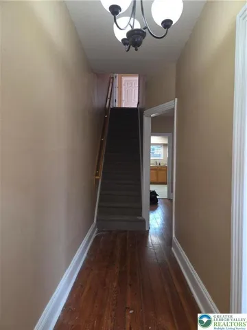 a view of gallery with wooden floor