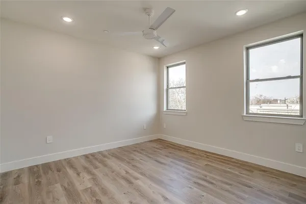 a spacious bedroom with a bed and a couch