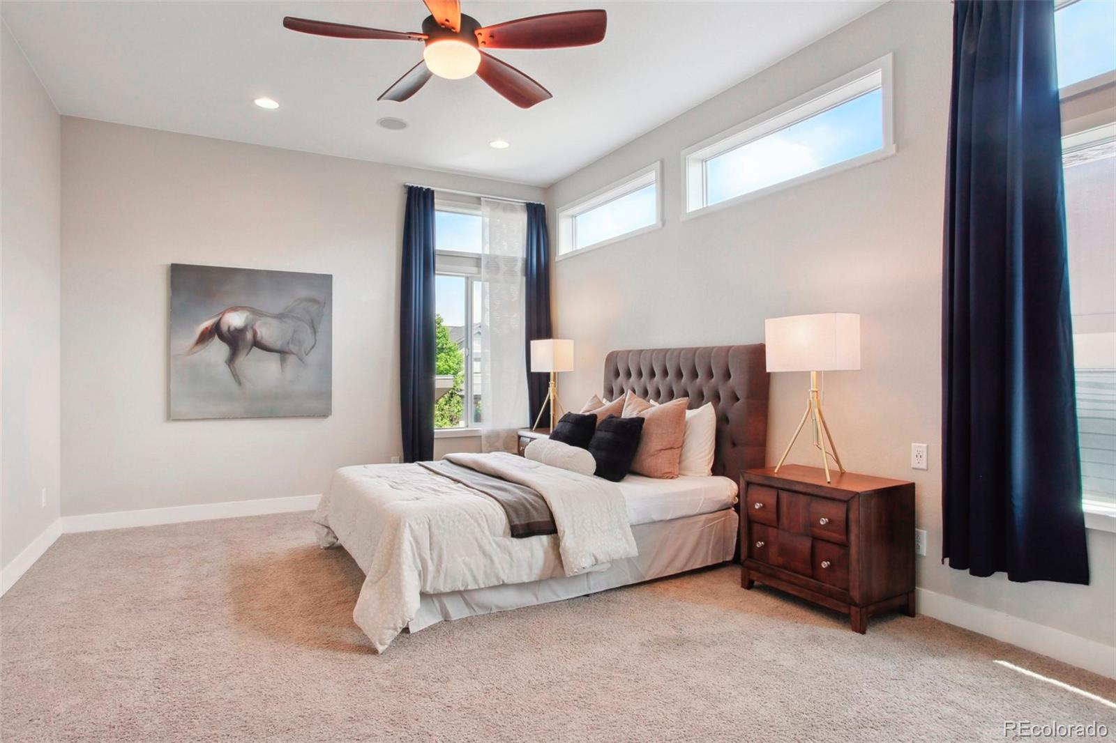 6735 Avrum Drive Denver, CO 80221 - Photo 13 of 29 a bedroom with a bed a dresser and potted plant