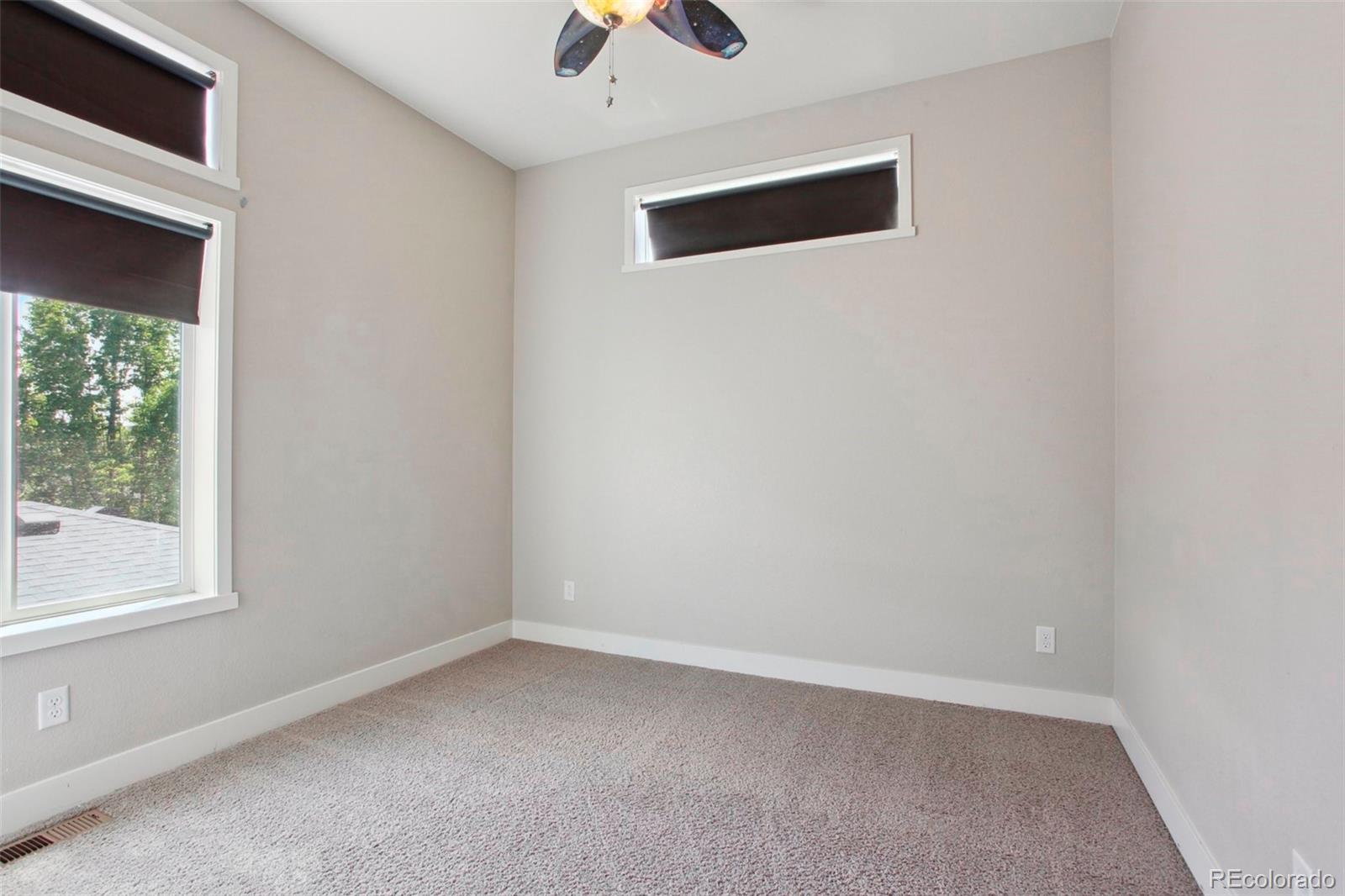 6735 Avrum Drive Denver, CO 80221 - Photo 18 of 29 an empty room with a window