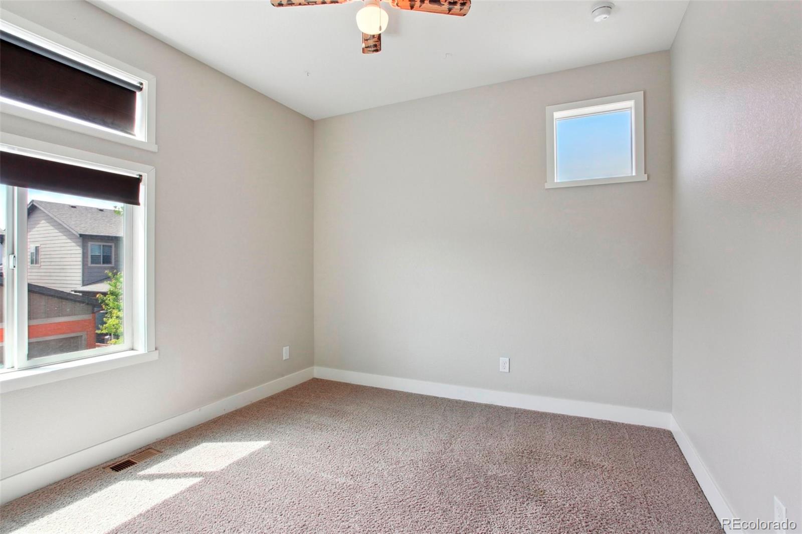 6735 Avrum Drive Denver, CO 80221 - Photo 21 of 29 a view of an empty room with a window