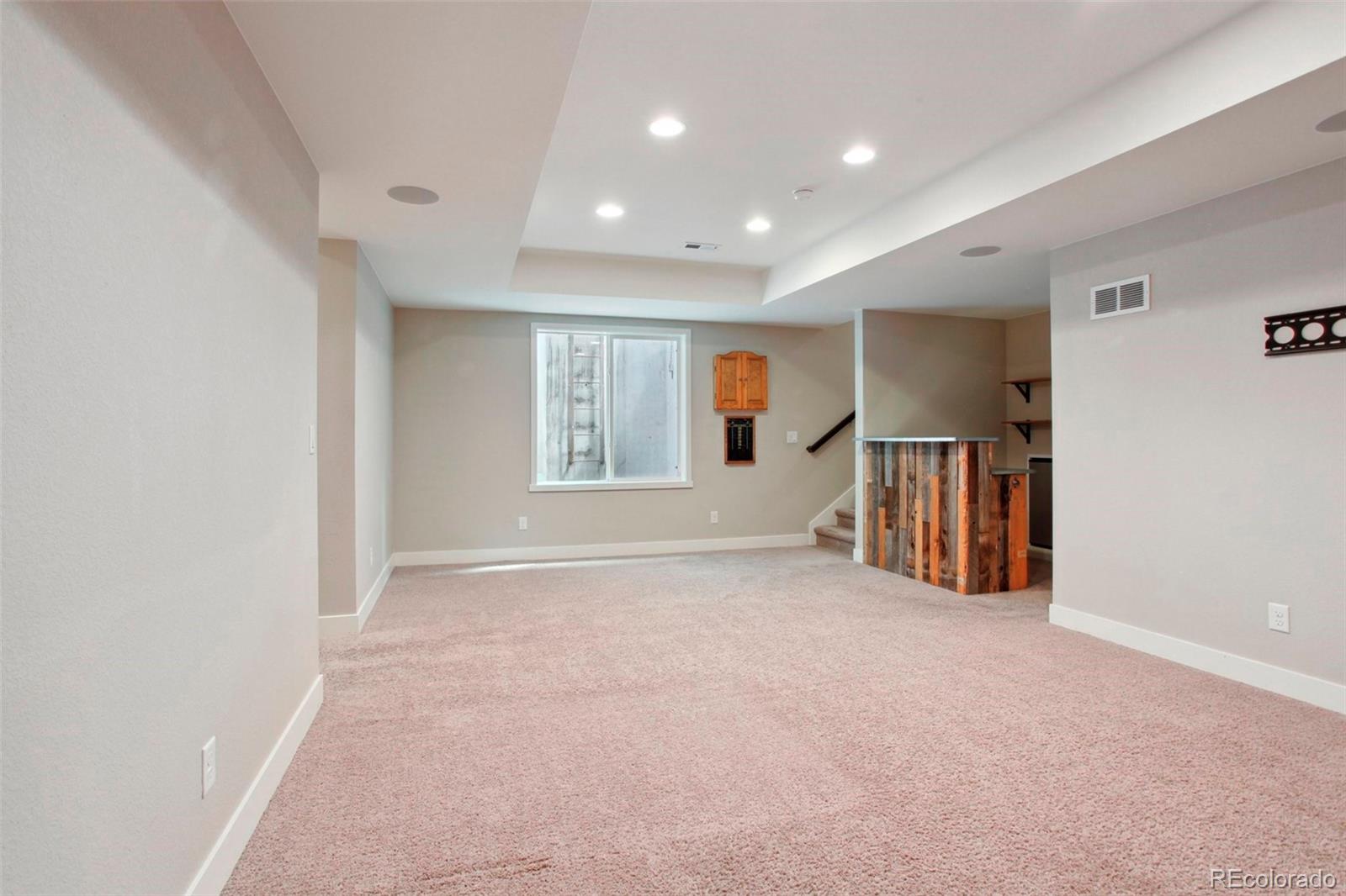 6735 Avrum Drive Denver, CO 80221 - Photo 23 of 29 a view of an empty room with windows