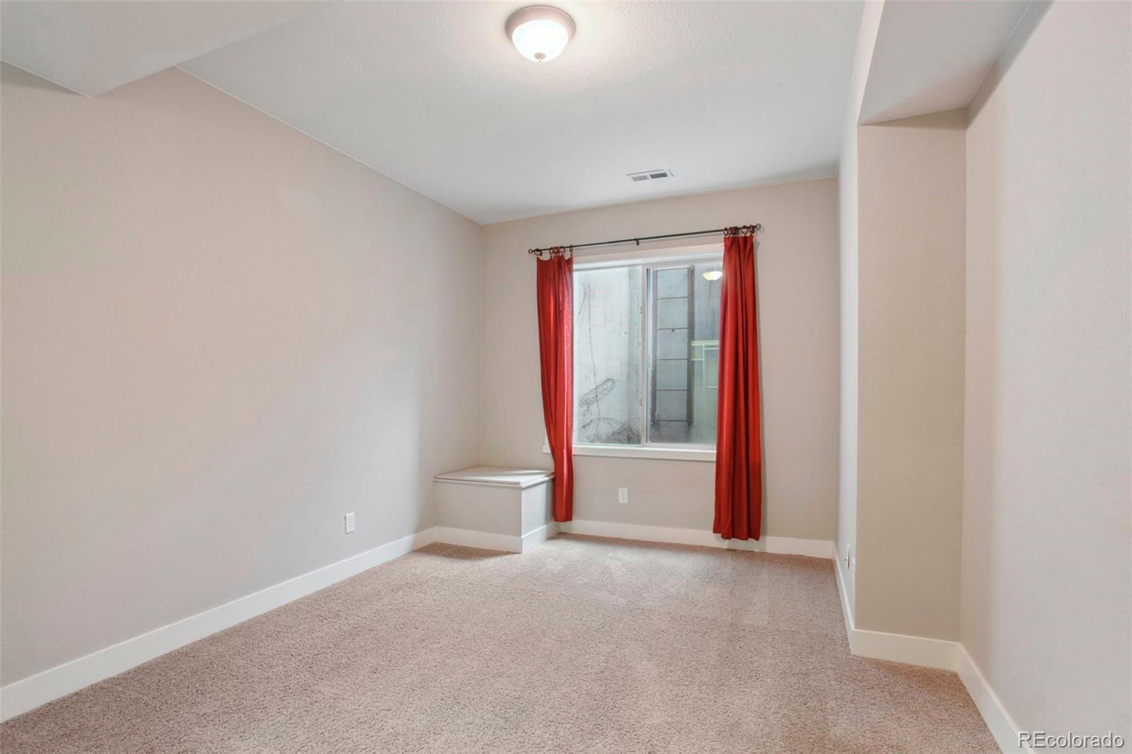 6735 Avrum Drive Denver, CO 80221 - Photo 25 of 29 a view of entryway with wooden floor