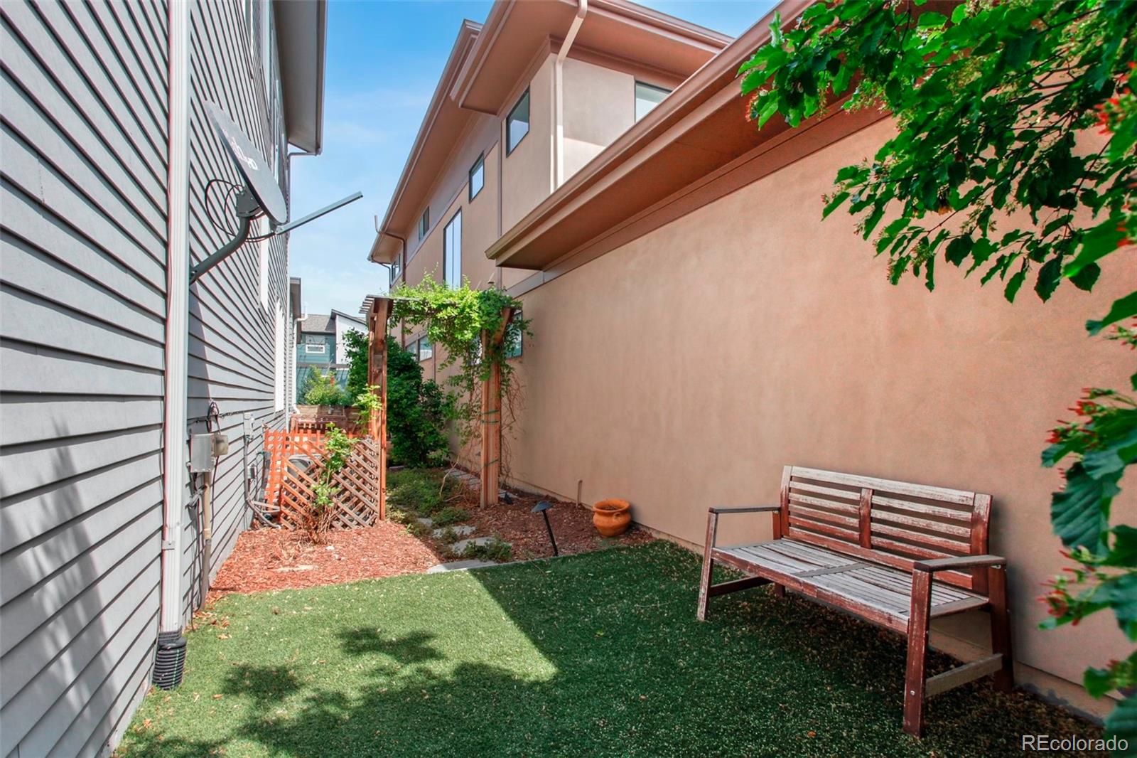 6735 Avrum Drive Denver, CO 80221 - Photo 28 of 29 a backyard of a house with seating space