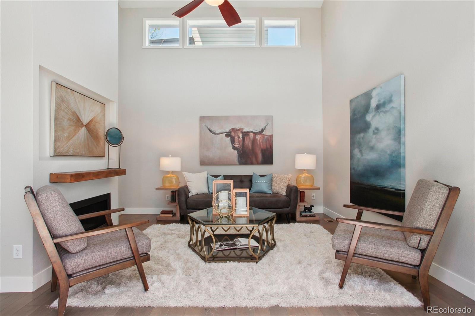 6735 Avrum Drive Denver, CO 80221 - Photo 3 of 29 a living room with furniture and wooden floor