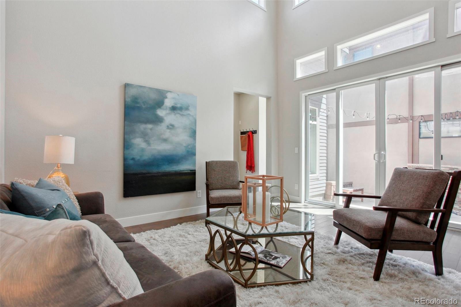 6735 Avrum Drive Denver, CO 80221 - Photo 4 of 29 a living room with furniture and a large window