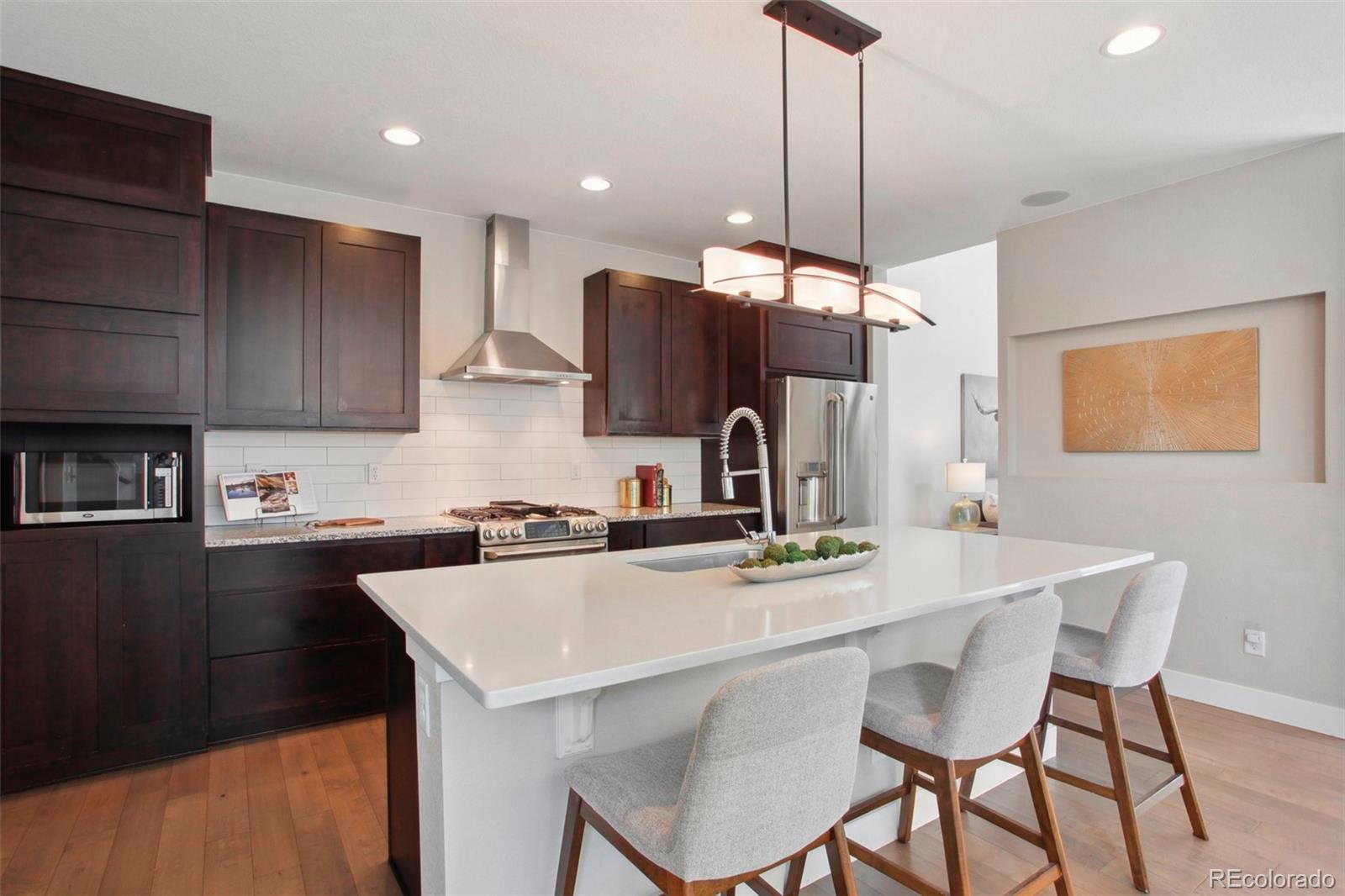 6735 Avrum Drive Denver, CO 80221 - Photo 8 of 29 a kitchen with a sink cabinets and window