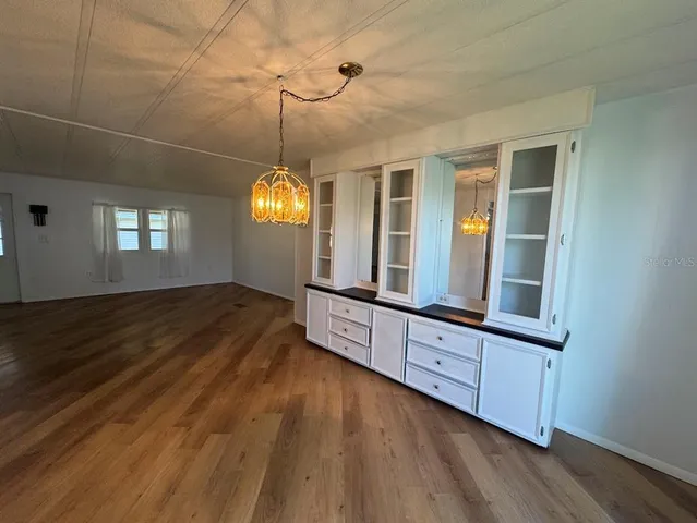a view of an entryway with wooden floor and a window