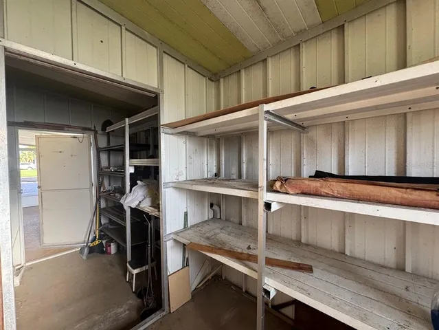 a kitchen with a sink cabinets and window