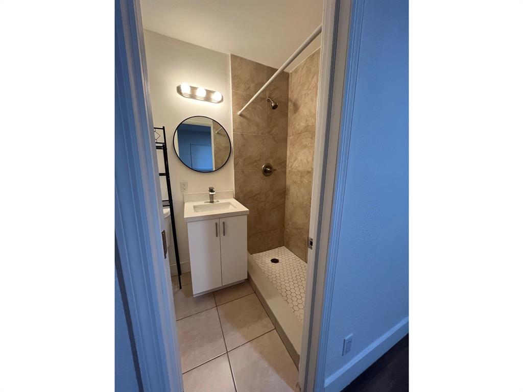 2300 Northwest 6th Street, Unit 9 Fort Lauderdale, FL 33311 - Photo 3 of 6 a bathroom with a toilet and a sink